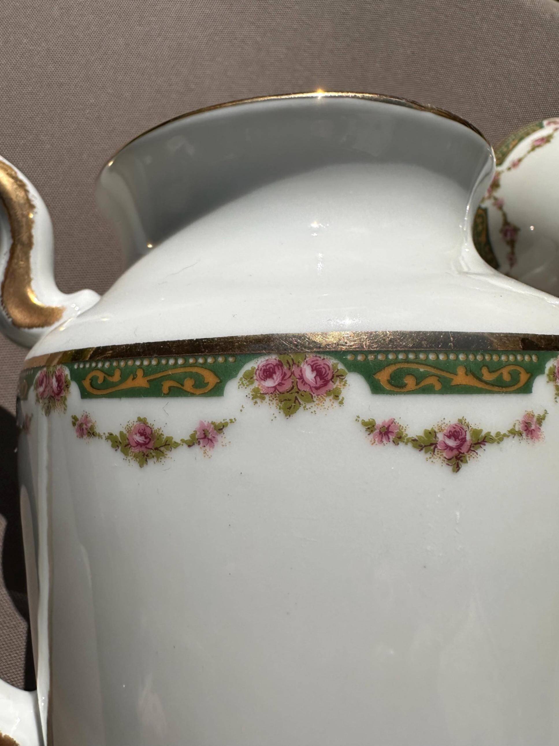 Set of jug, sugar bowl, and milk jug in Limoges porcelain by Paul Past.