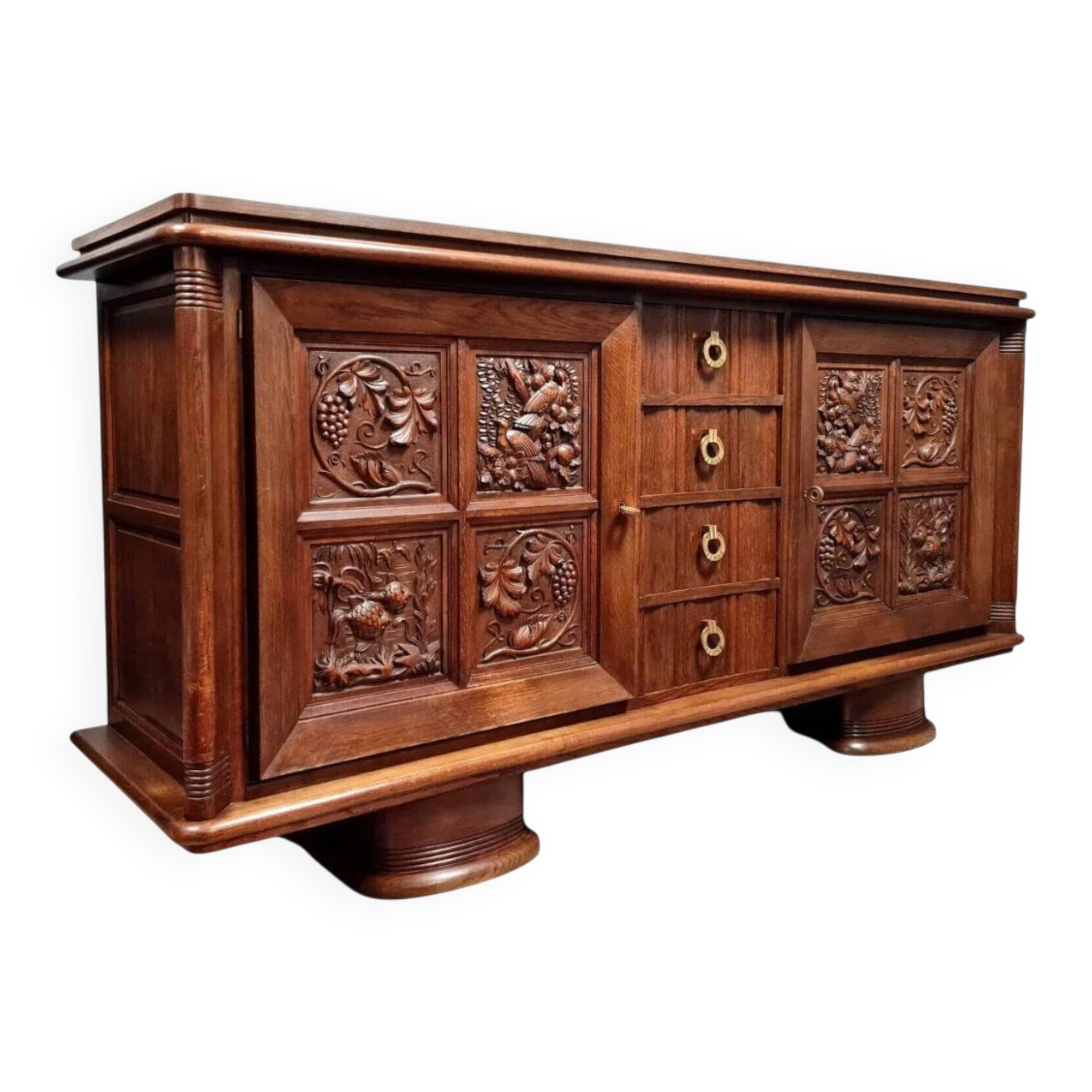According to Charles Dudouyt: sideboard in a row in solid oak.