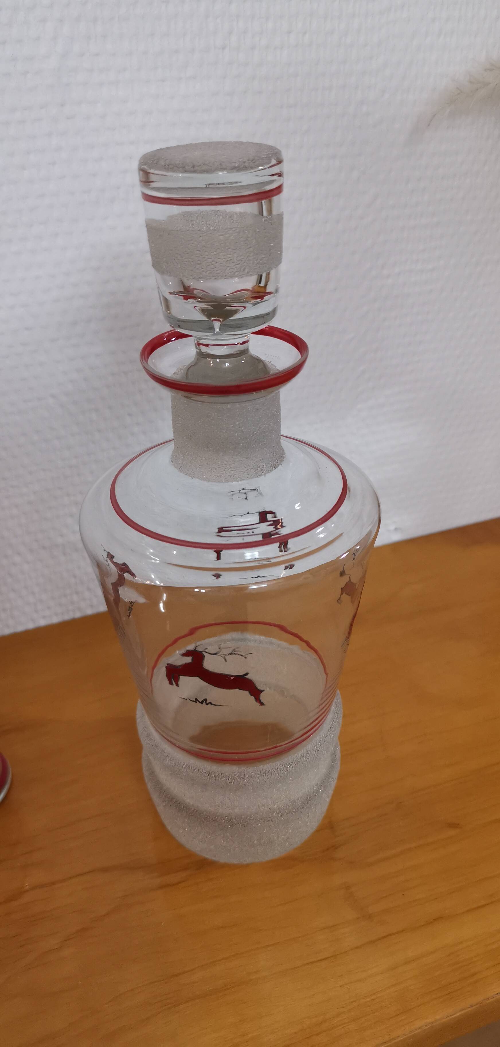 Glasses and carafe decorated with red Christmas reindeer and white granita 60's