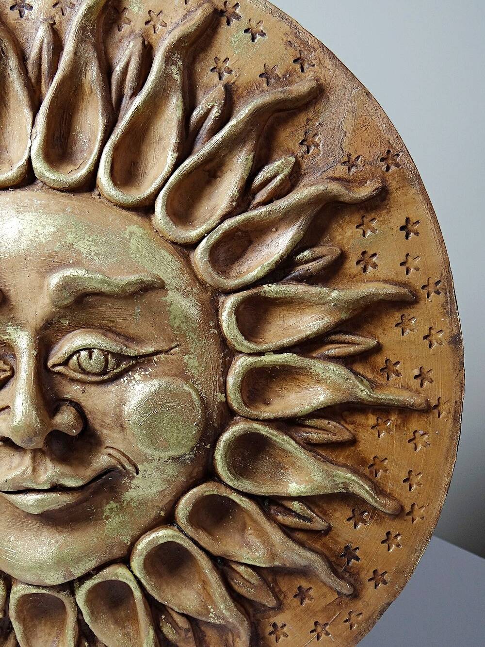 Anthropomorphic sun wall sculpture in patinated terracotta, vintage Italian craftsmanship.