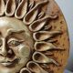Anthropomorphic sun wall sculpture in patinated terracotta, vintage Italian craftsmanship.