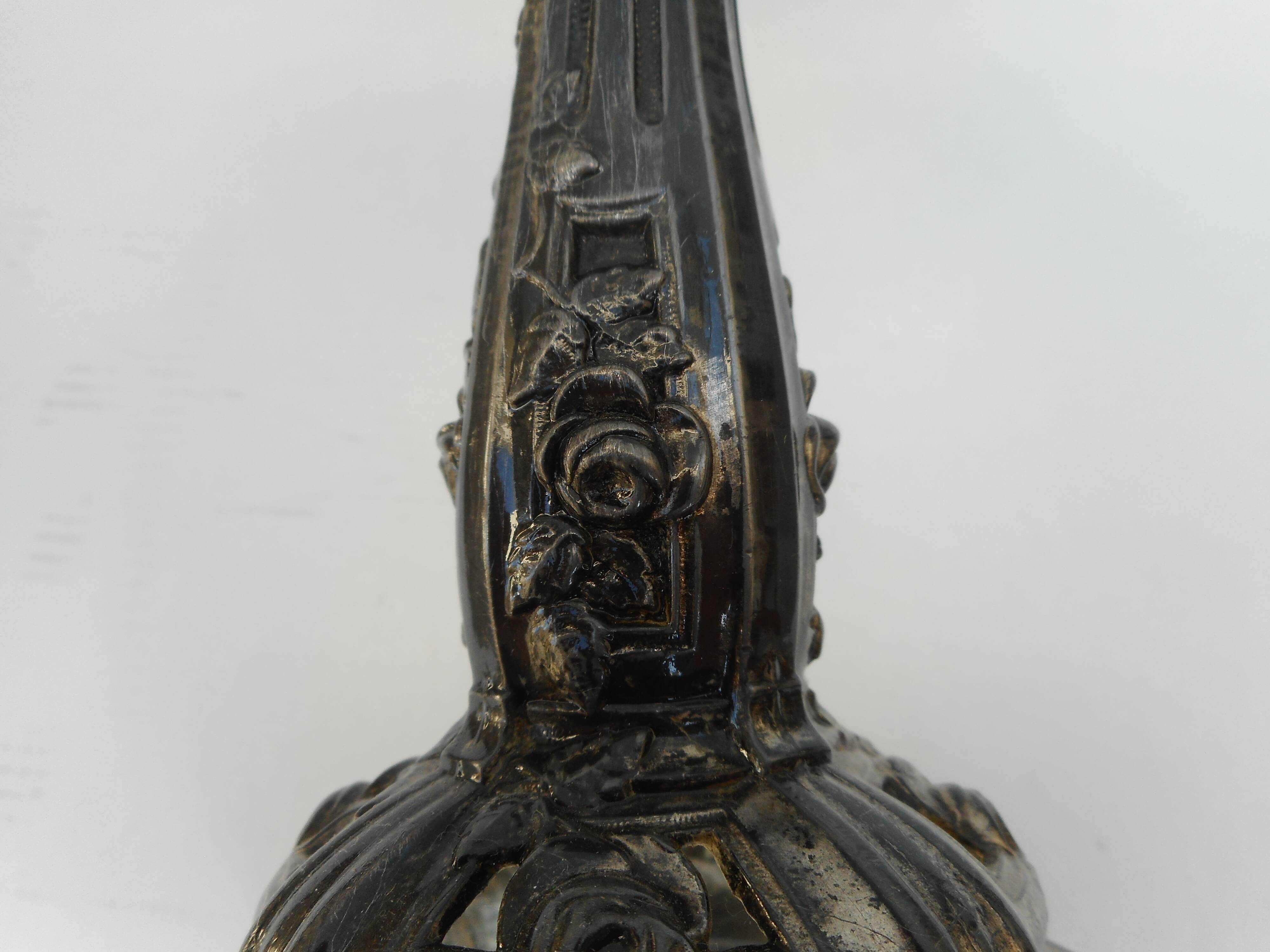 A glass cup on metal stand