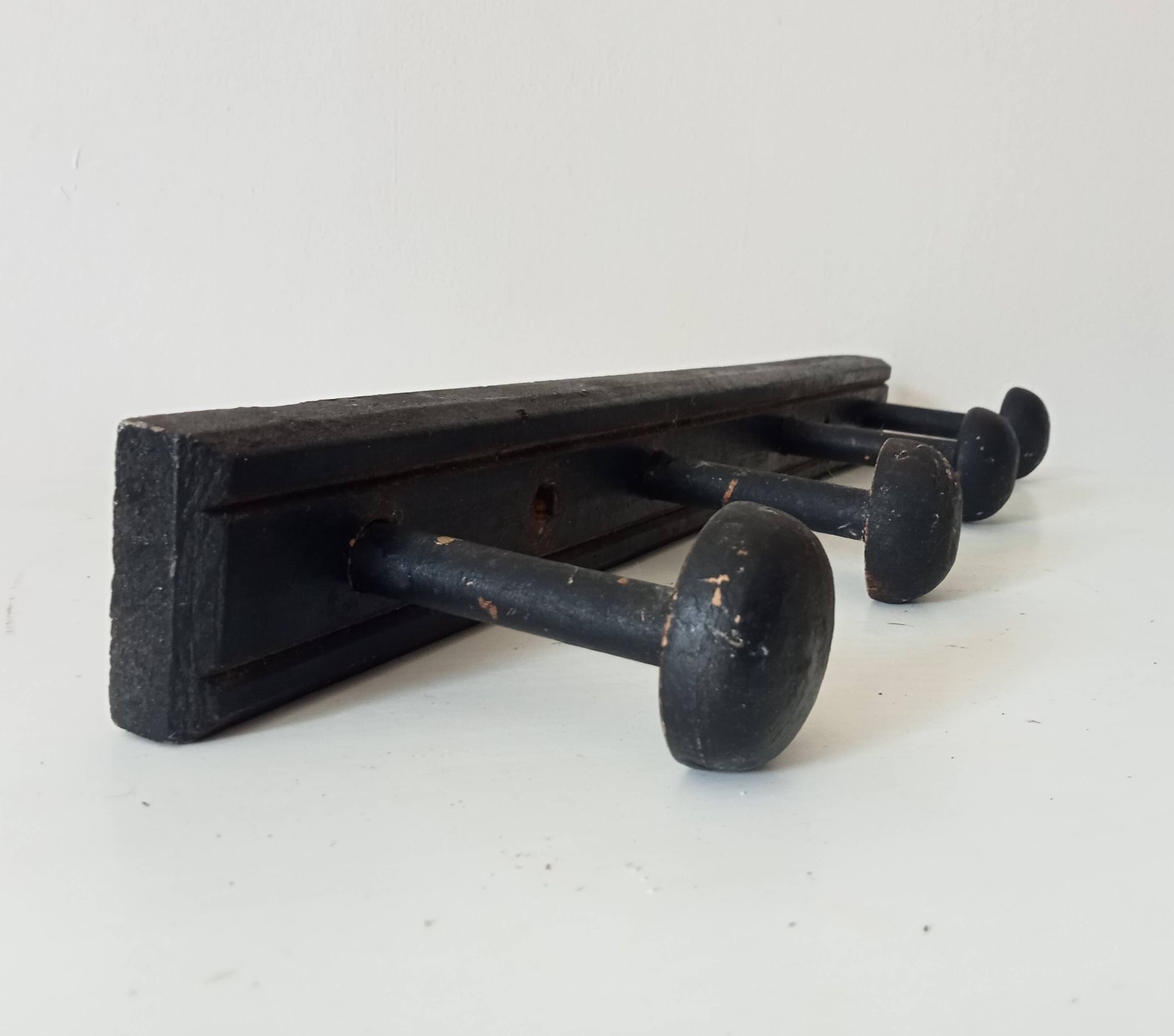 Old wooden wall coat rack