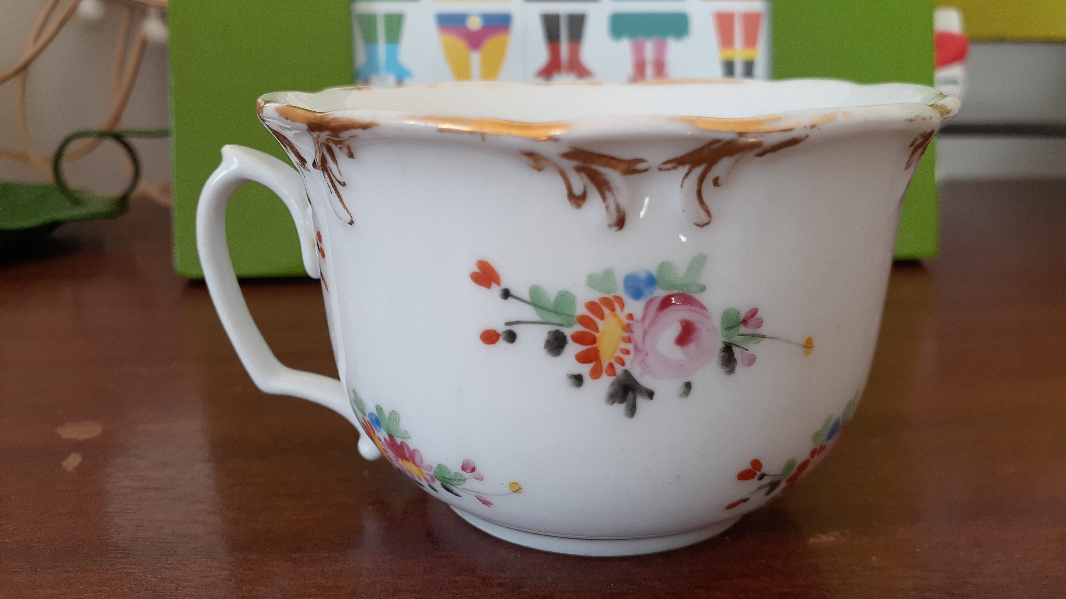 Antique flowered porcelain cup