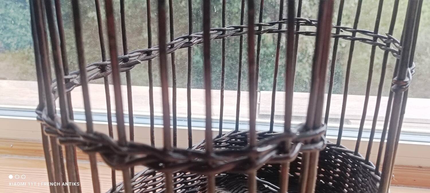 The vintage mini-bar made of wicker and rattan is both decorative and practical.