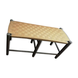 Wooden bench over cotton straps
