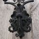 Pair of black wrought iron wall sconces - neo-Gothic style - from the 1950s