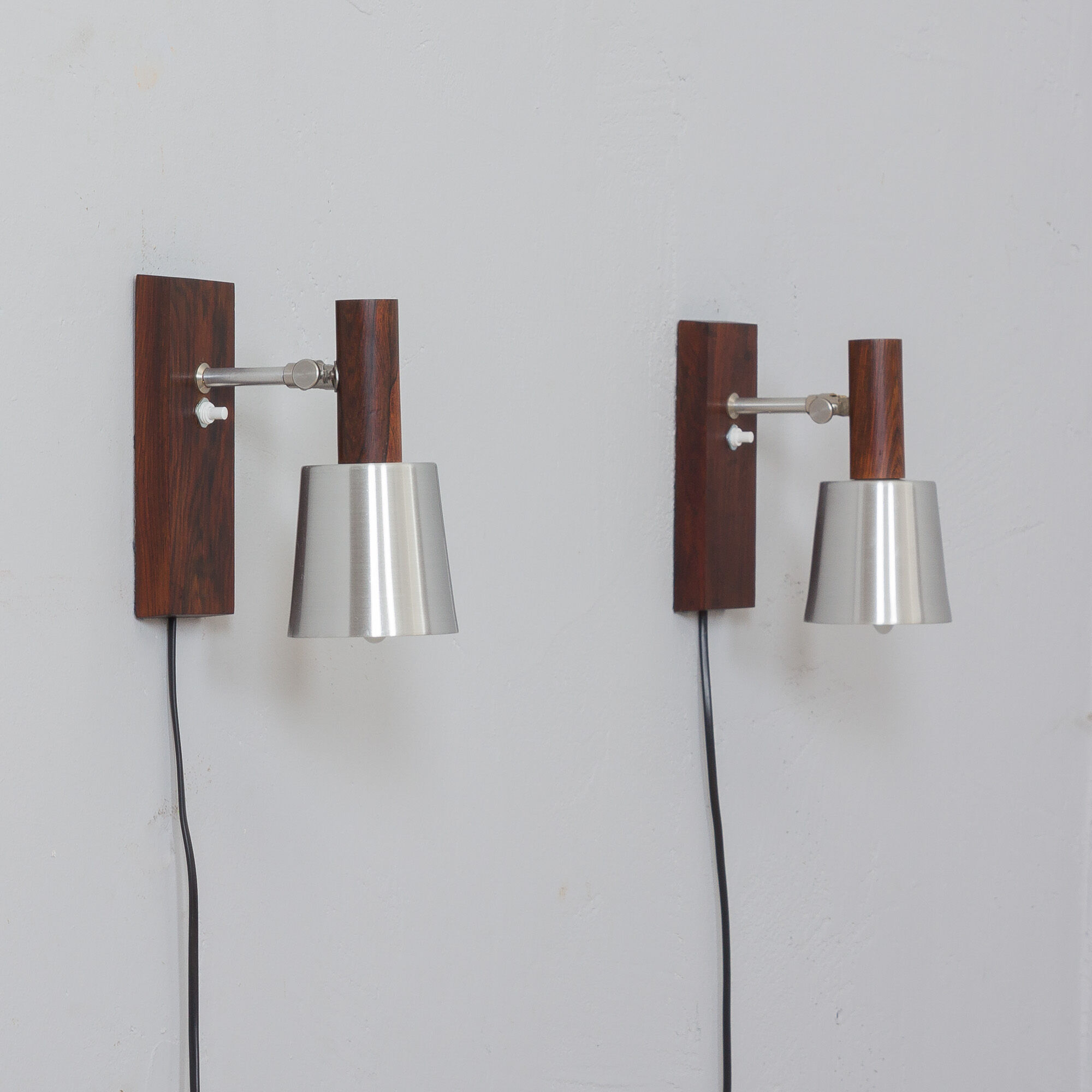 Pair of Jo Hammerborg  rosewood wall sconces with aluminium shades, Denmark 1960s