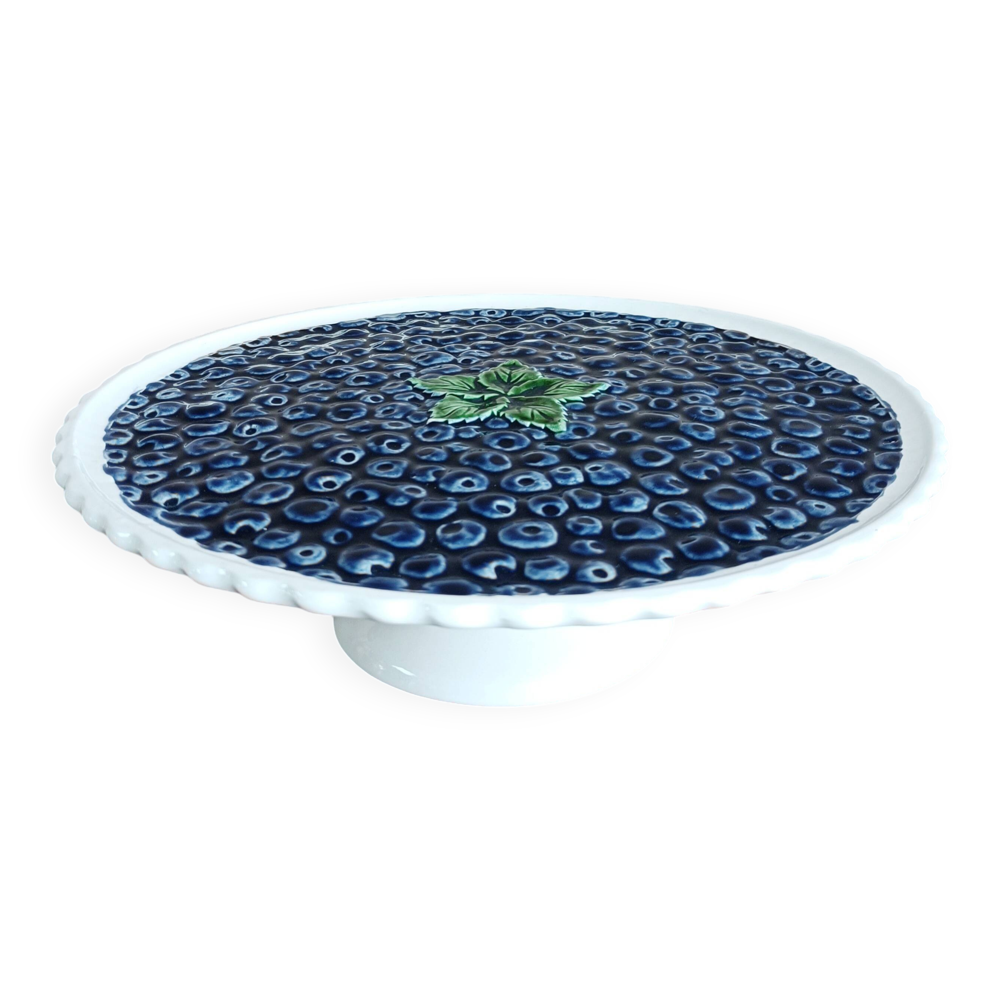 Pie dish on foot, in slip with blackberry decoration