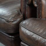 Set of two characterful sheepskin armchairs with a beautiful deep colour