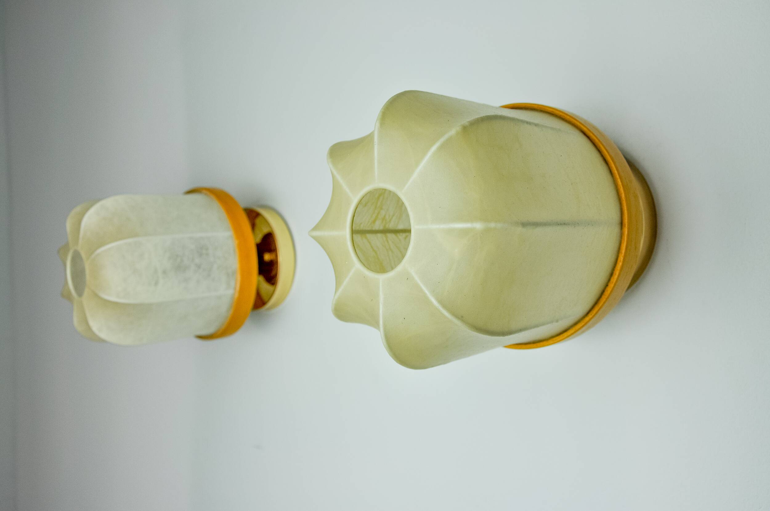 Pair of "cocoon" wall lights, resin and pine, Italy, 1970