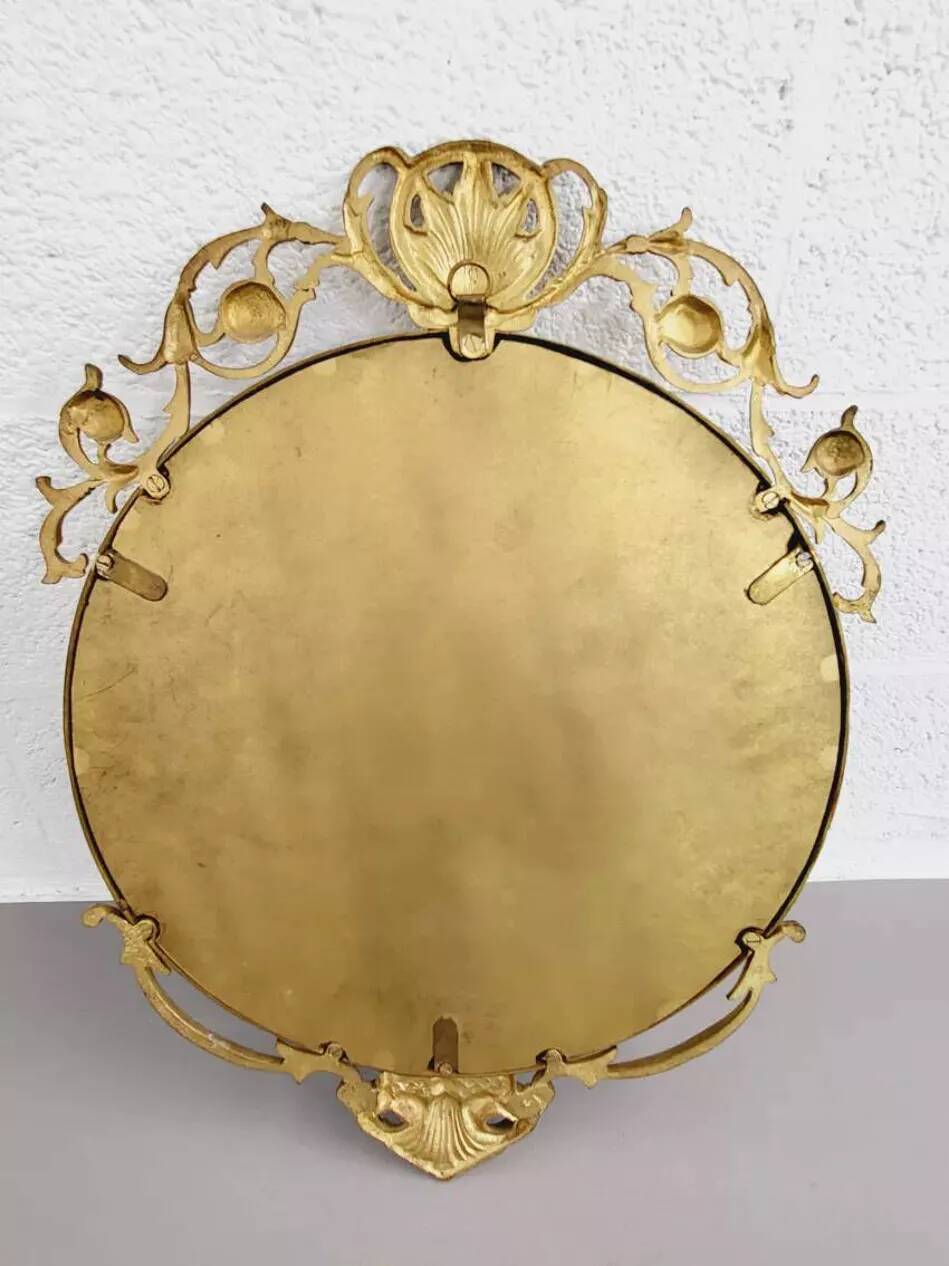 Round brass medallion style mirror