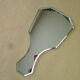 Bevelled hand mirror