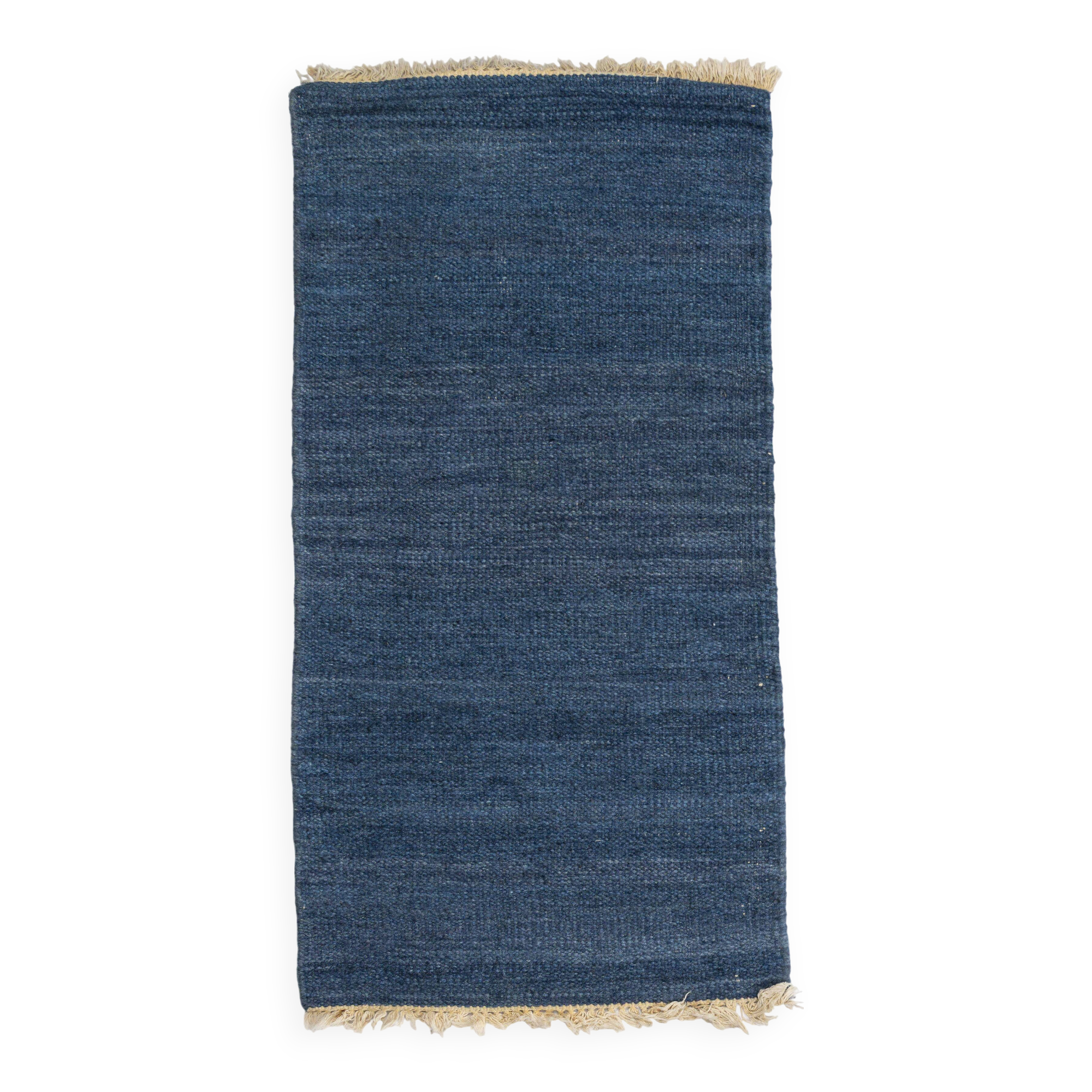 Scandinavian style minimalist flat weave rug. A small one.