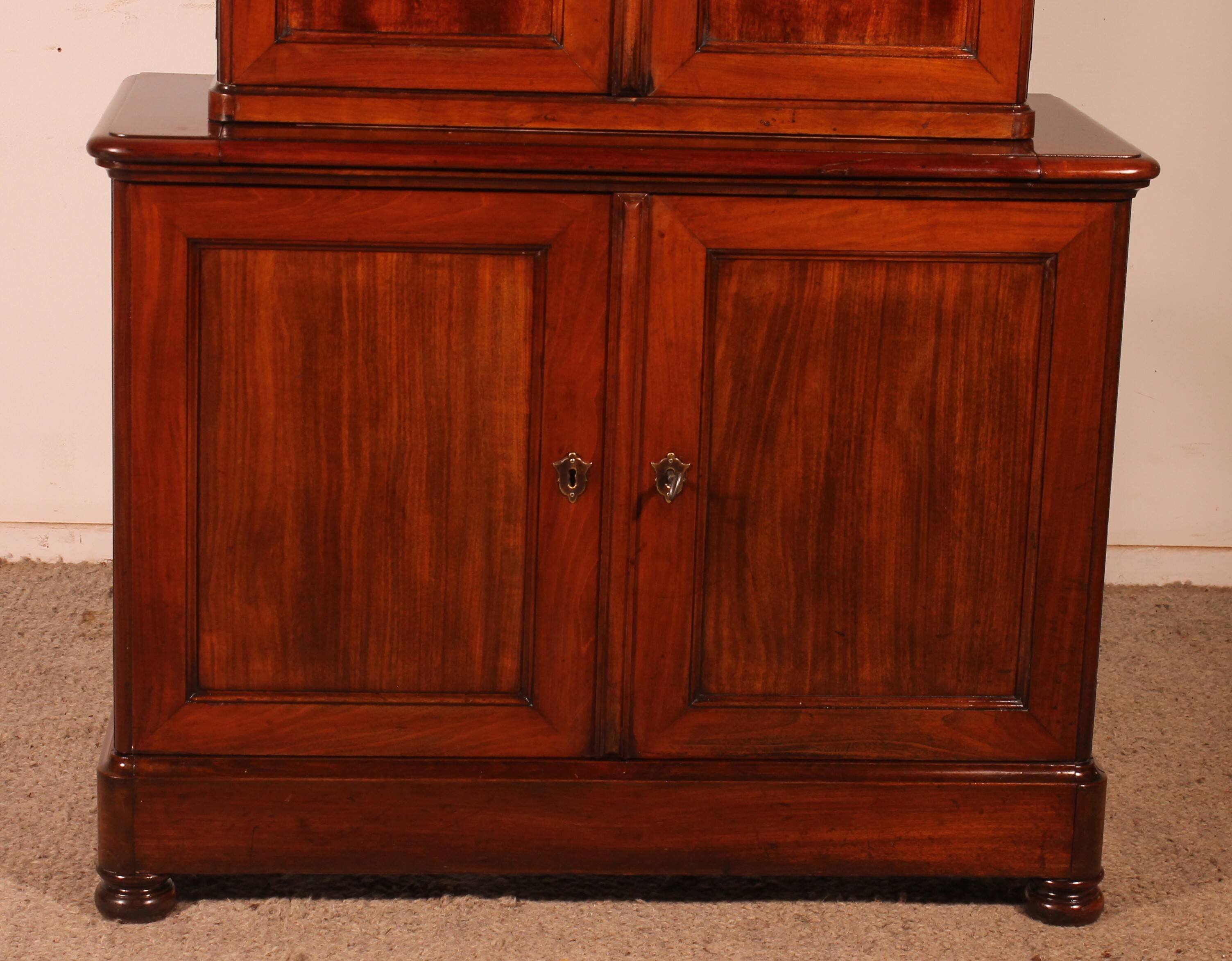 small two-body solid mahogany desk from the early 19th century with writing surface