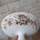 Flat serving compote dish in Terre de Fer HB & Cie with brown floral decoration.