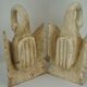 Deux ornements d'applique en bois sculpté et laqué crème,  représentant des cygnes