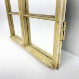 Vintage wooden window converted to a mirror