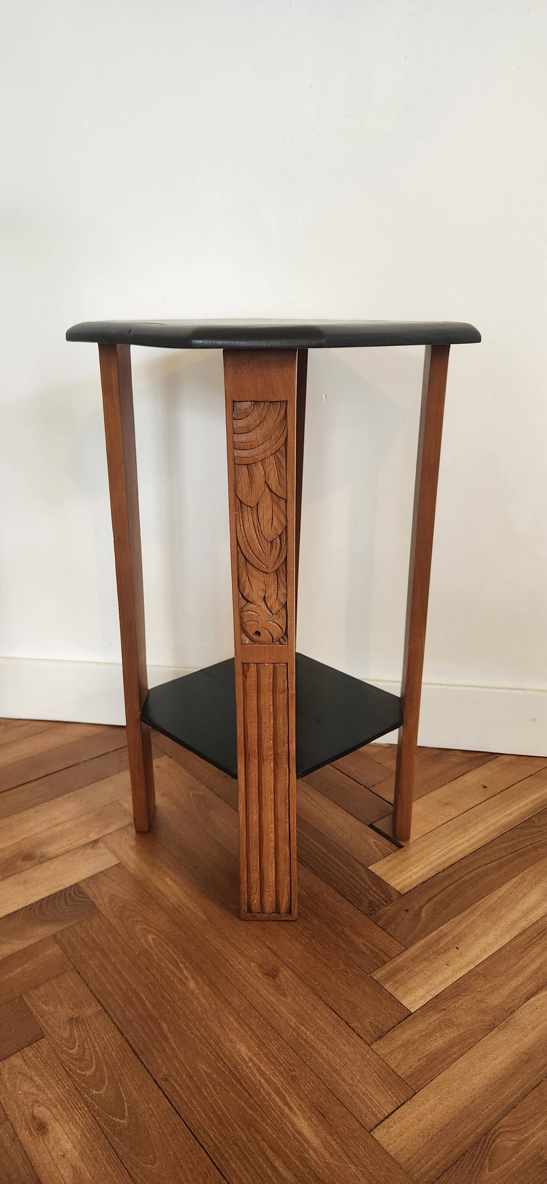 Art Deco console with sculpted black lacquered legs.