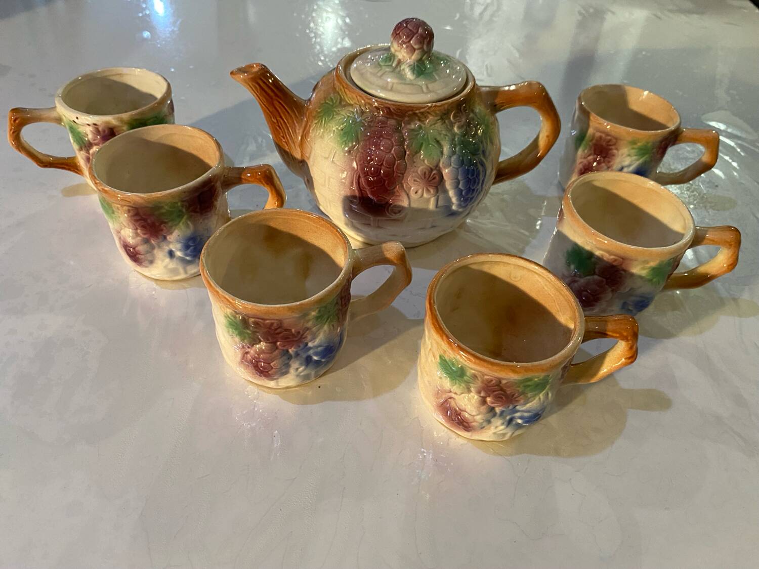 Vintage earthenware teapot and cup set