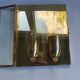 Pair of wall sconces in gold-plated brass with bevelled glass, Italian.