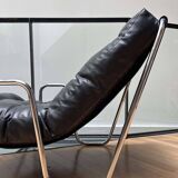 Pair of vintage armchairs in black imitation leather and chrome metal, France 1970