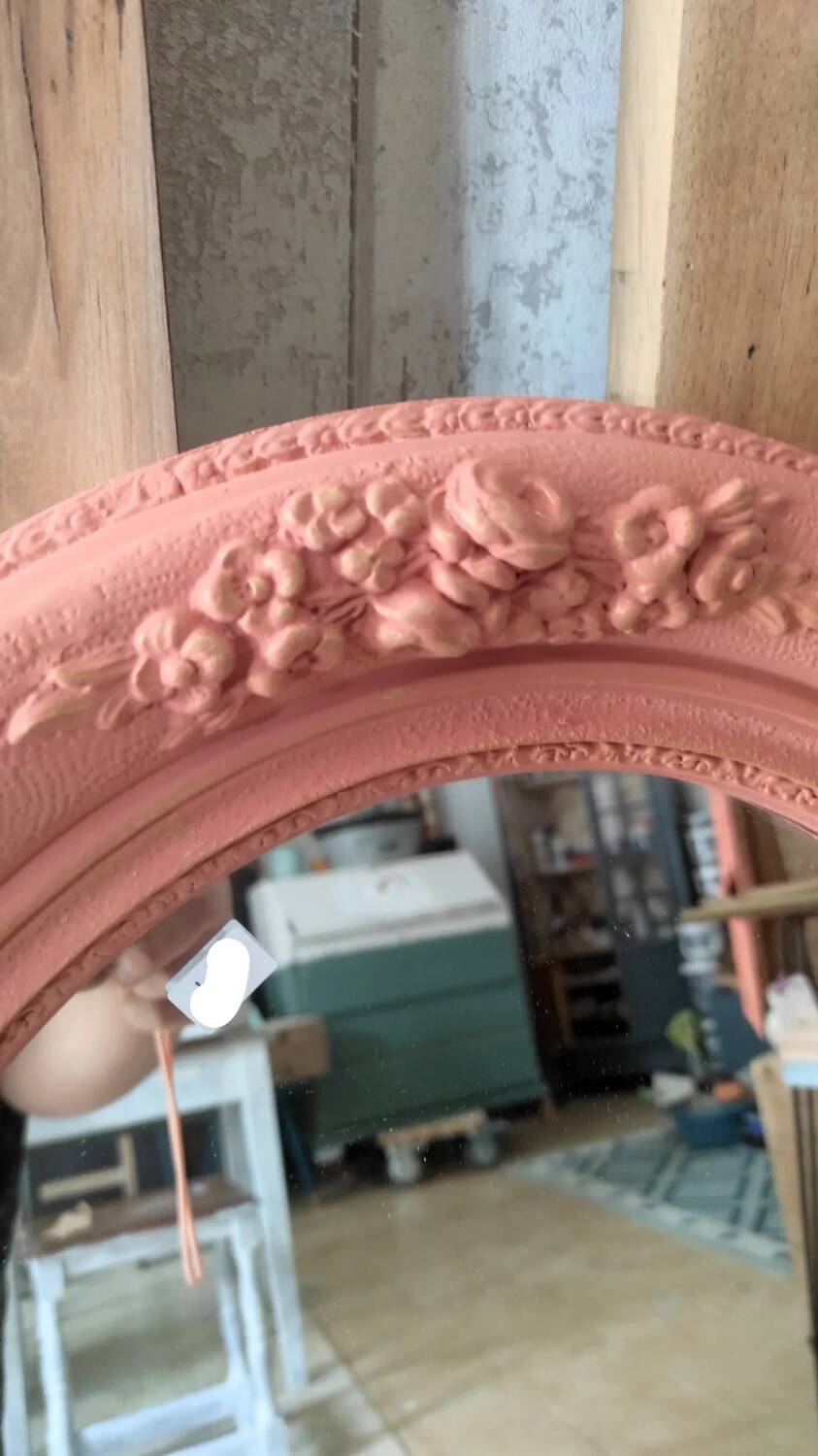 Oval terracotta mirror with pink shapes in resin