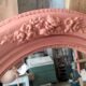 Oval terracotta mirror with pink shapes in resin