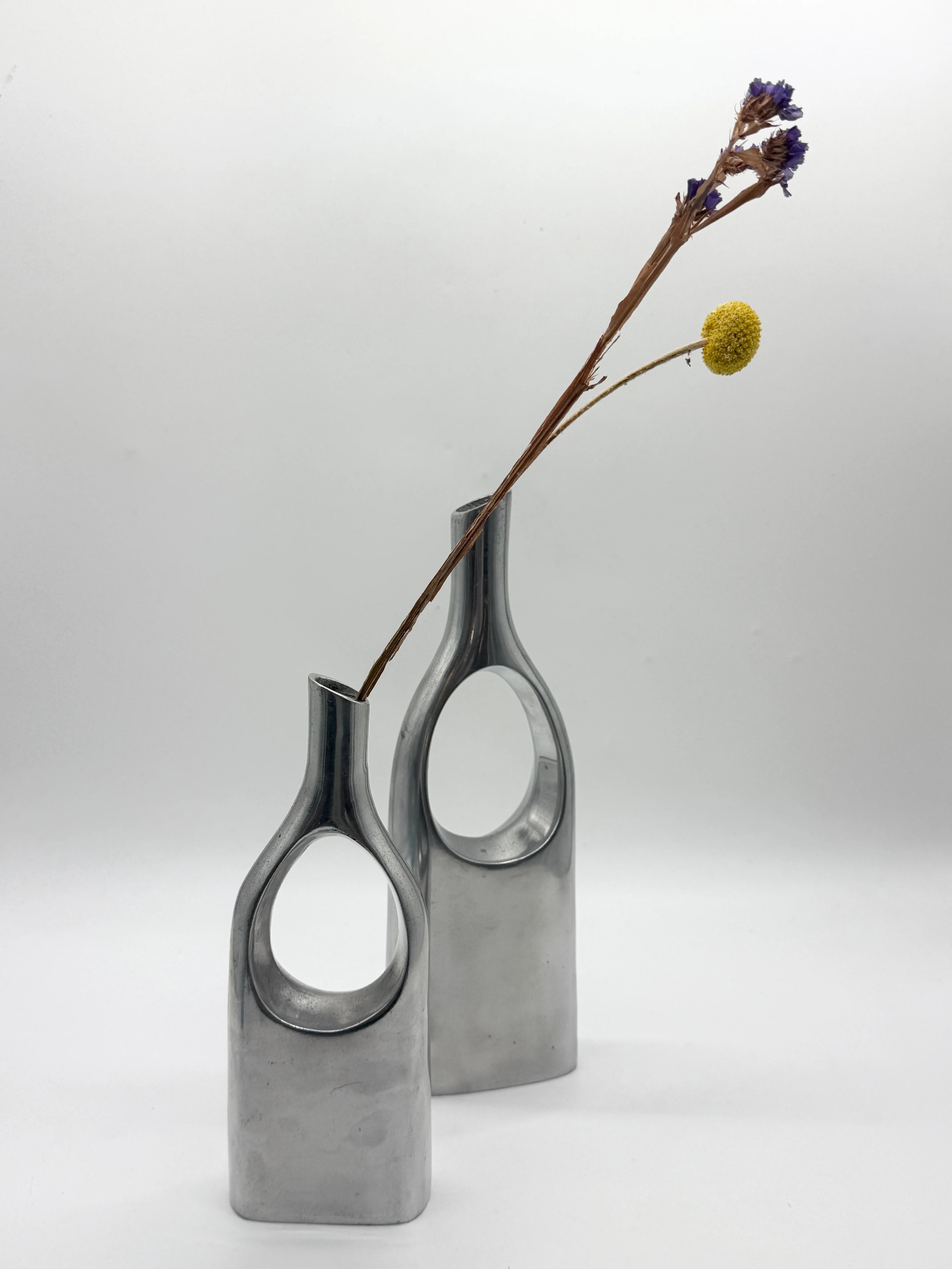 Pair of "drop" vases in aluminium cast, Italy, 1970s