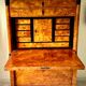 Secretary with a drop-leaf in pine and ebony, in Biedermeier style.