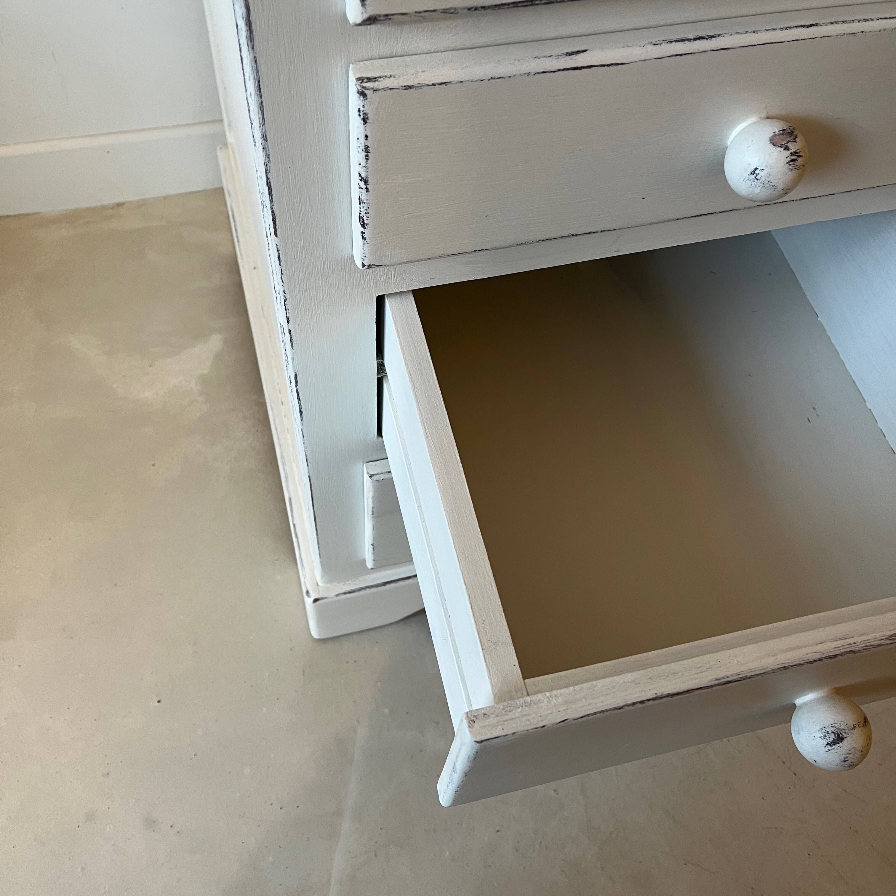 White patinated chest of drawers