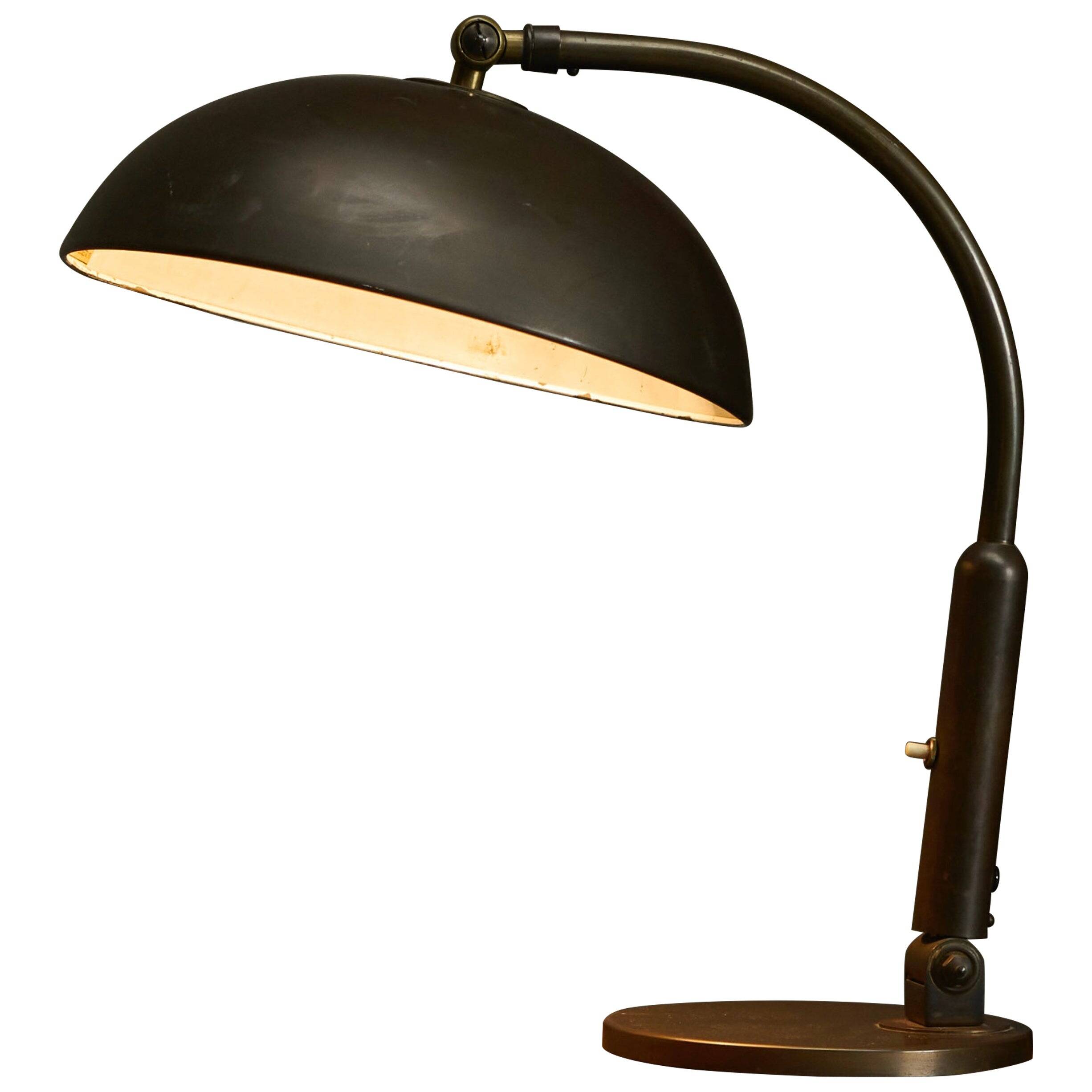 Modernist desk lamp in patinated brass from the 1930s.