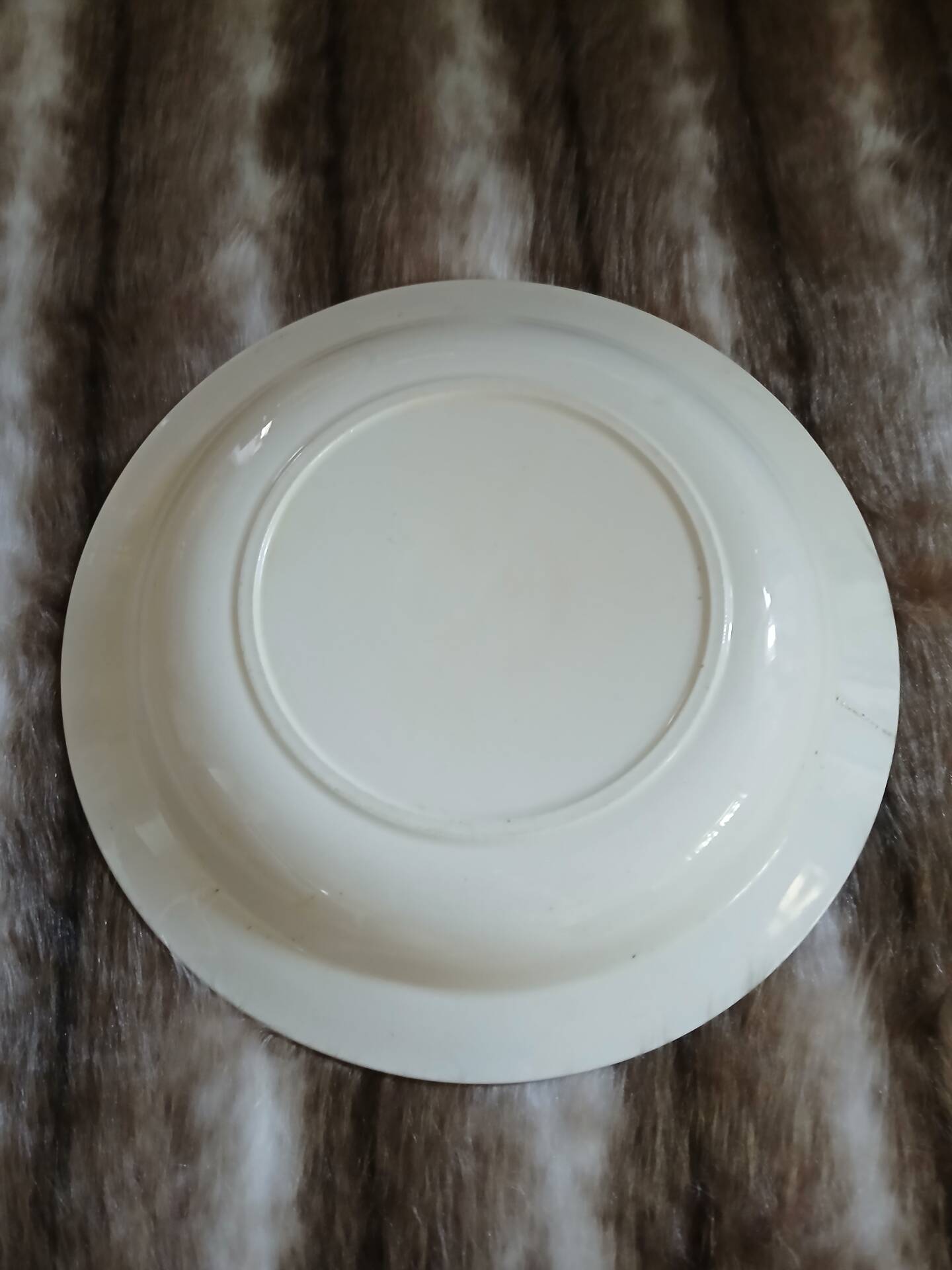 Old hollow dish made of Salins ironstone.
