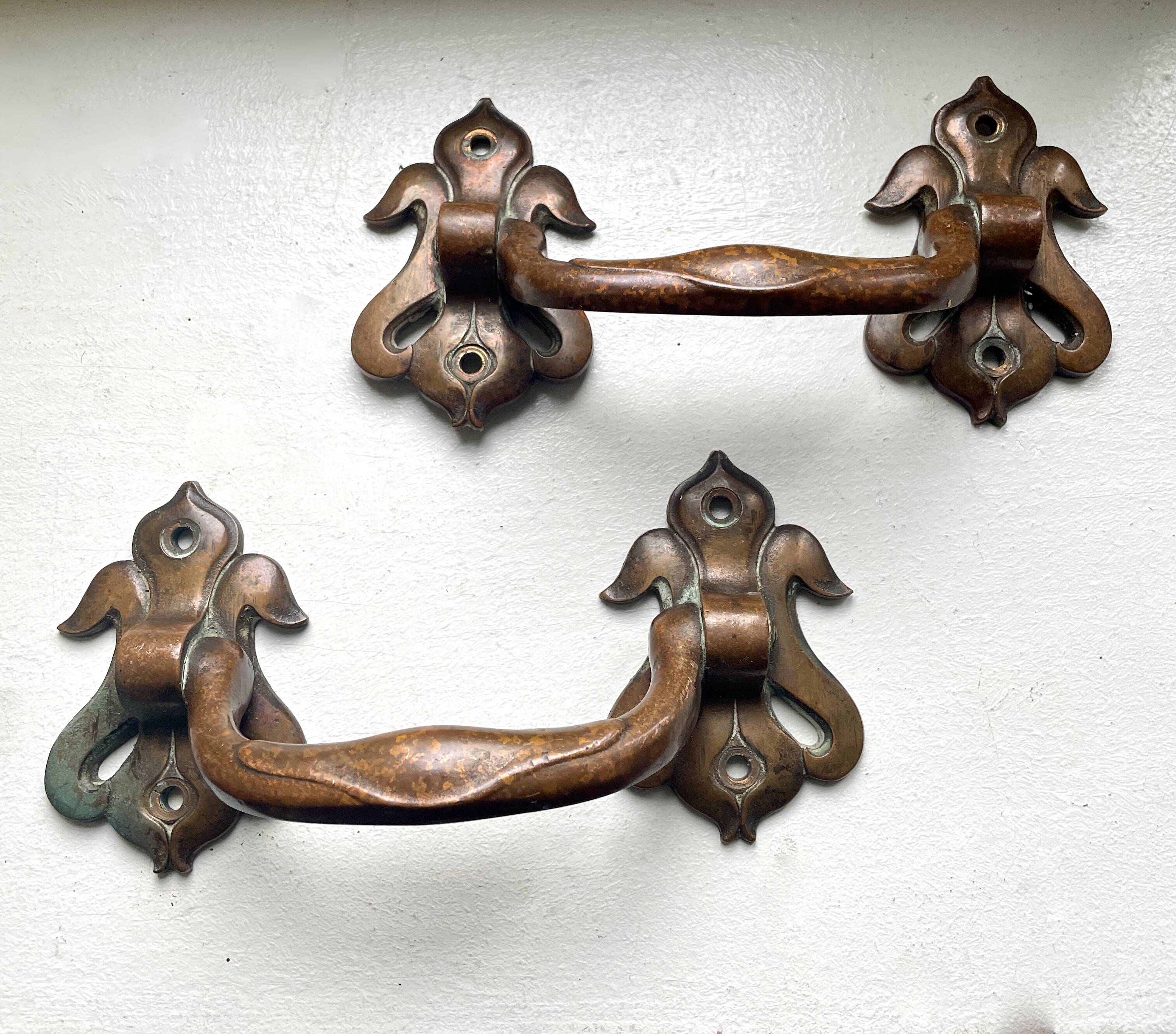 Pair of bronze handles by Emile Muller, 19th century.