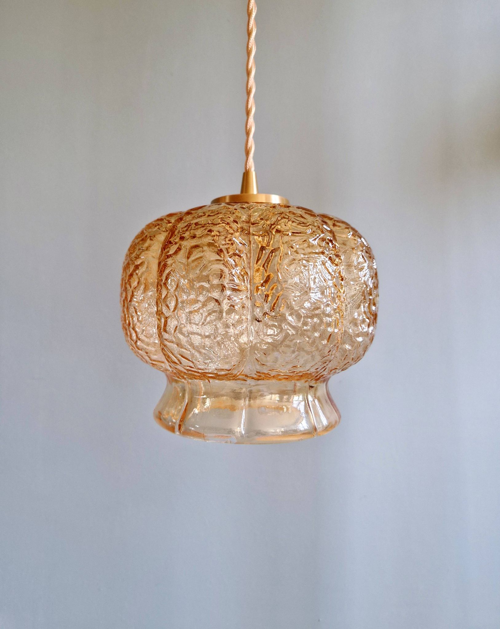 Vintage trio of amber glass pendants, 1960s-70s.