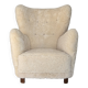 Fauteuil danois des années 1960, en véritable peau de mouton "Canberra", retapissé.