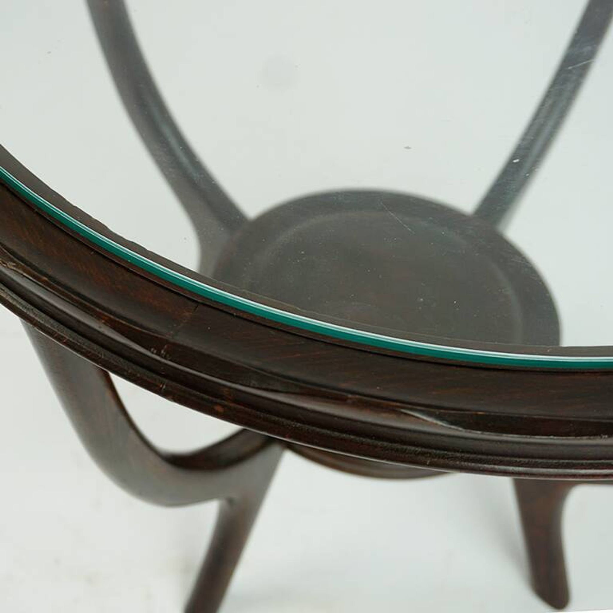 Italian round coffee table from the 1950s with a glass top, attributed to Carlo di Carli.