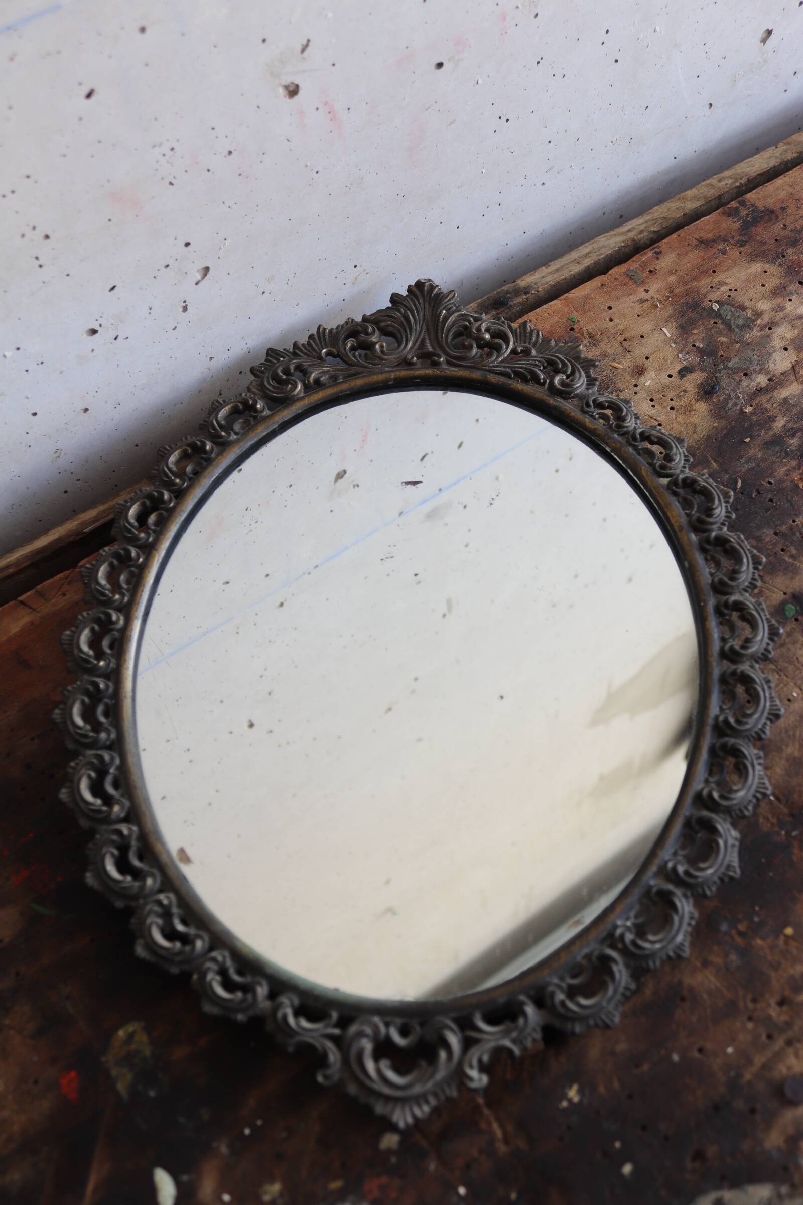 Baroque style oval metal mirror