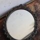 Miroir ovale en métal style baroque