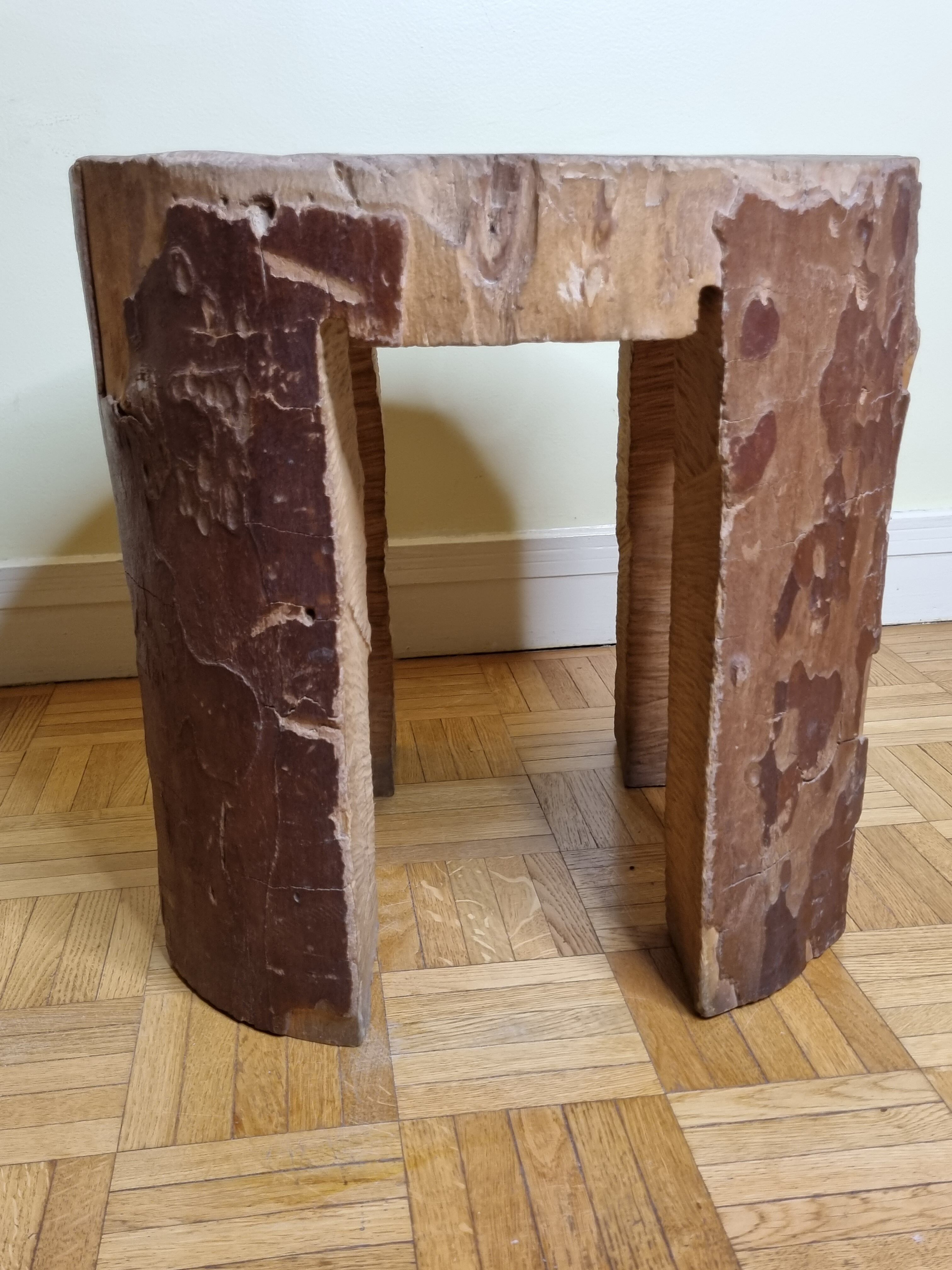 Brutalist solid wood coffee table carved from a room in a plane tree trunk