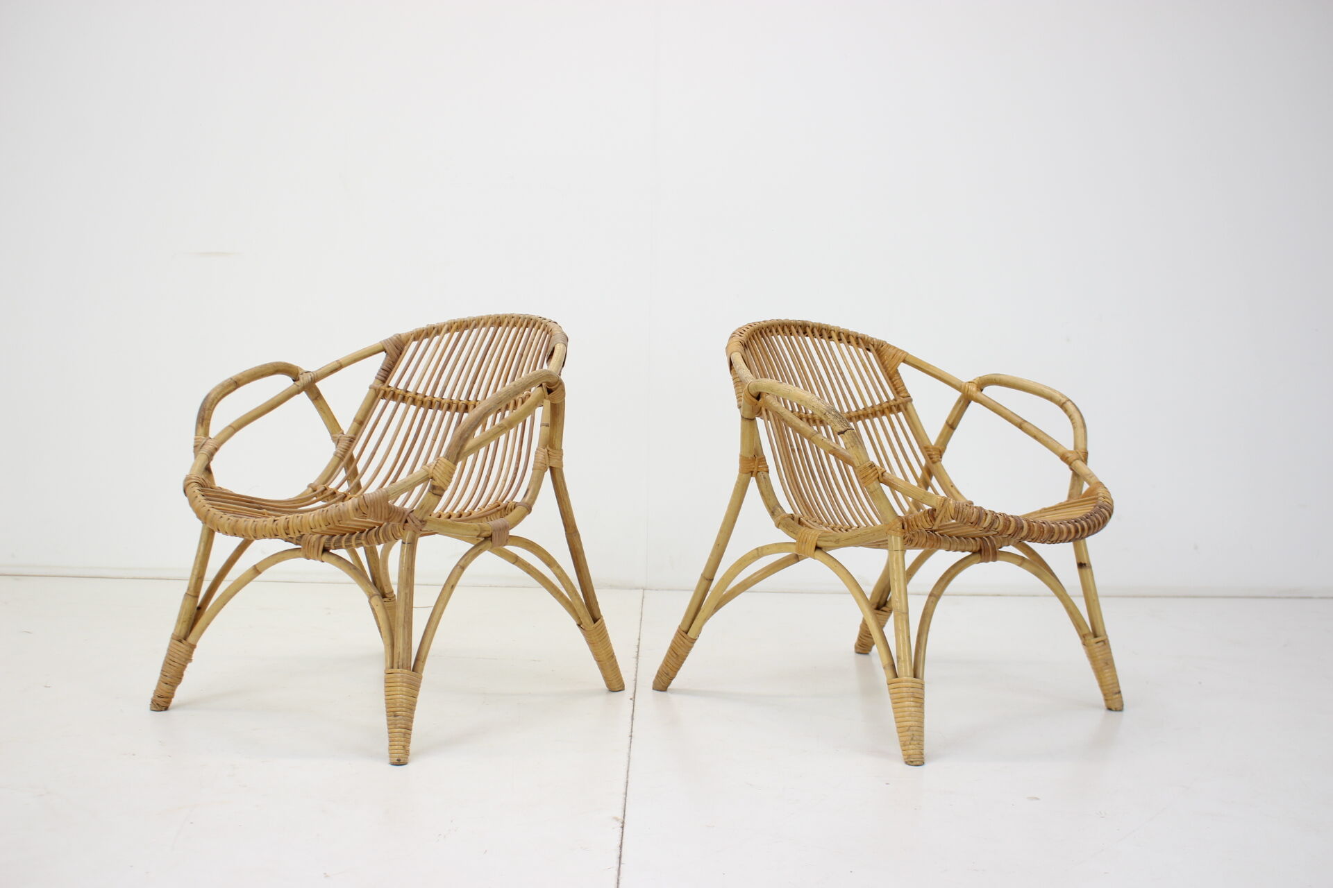 Pair of Alan Fuchs rattan lounge chairs, Czechoslovakia, 1960s