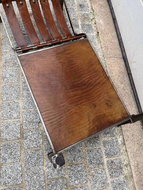 Brutalist coffee table in wrought iron and leather.