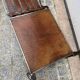 Brutalist coffee table in wrought iron and leather.