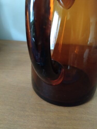 Vintage pitcher in amber glass