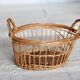 Round openwork wicker storage basket with braided handles