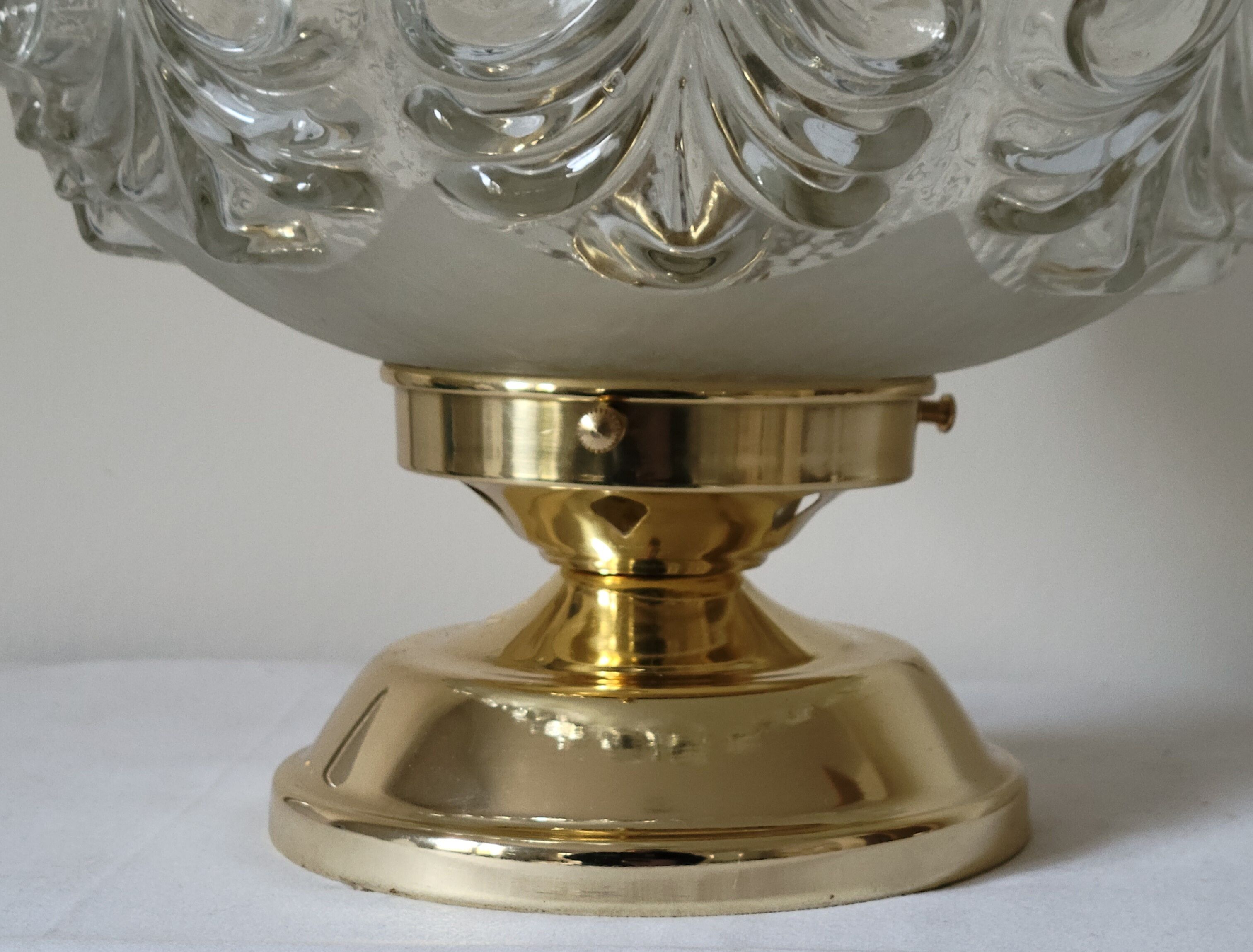 Brass lamp with molded glass globe