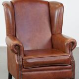 Cognac-colored cowhide wingback chair