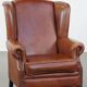 Cognac-colored cowhide wingback chair