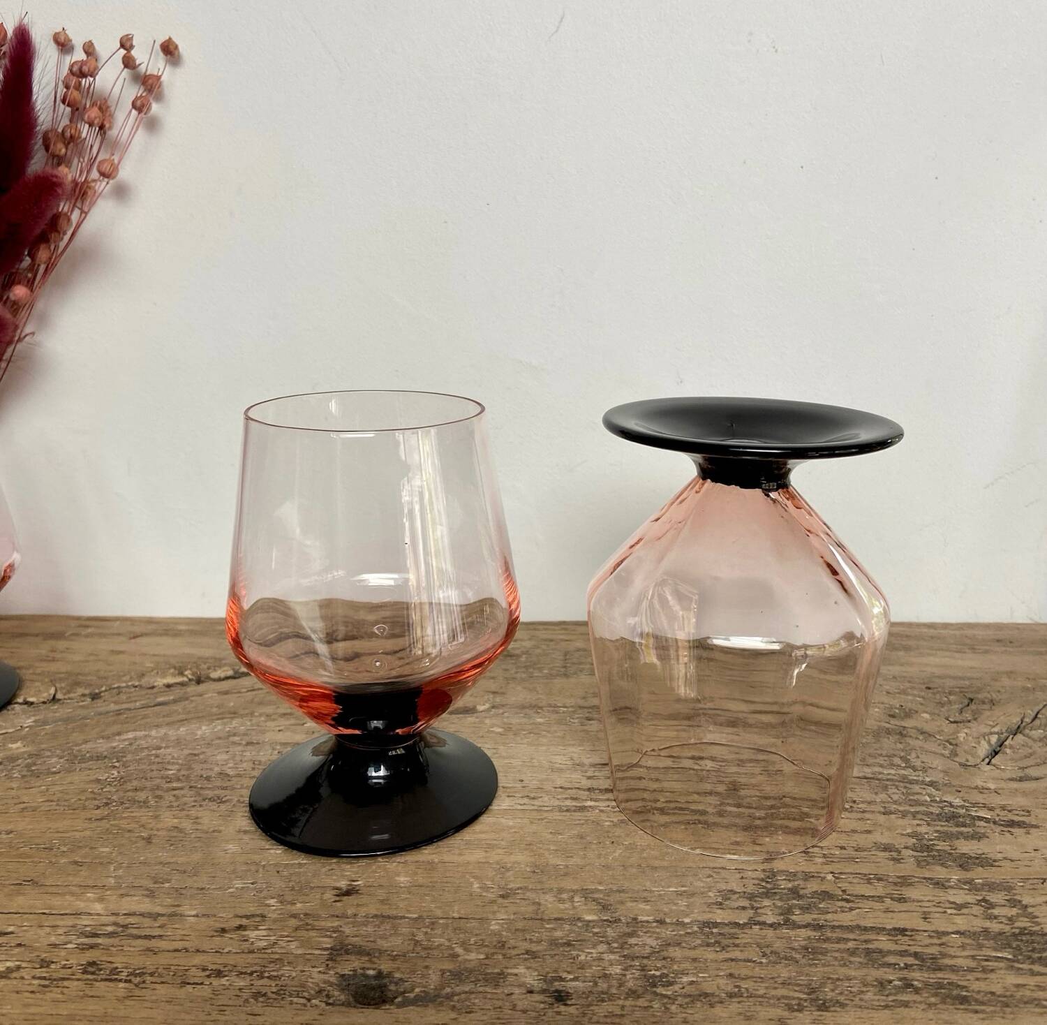 4 pink glasses with black stem