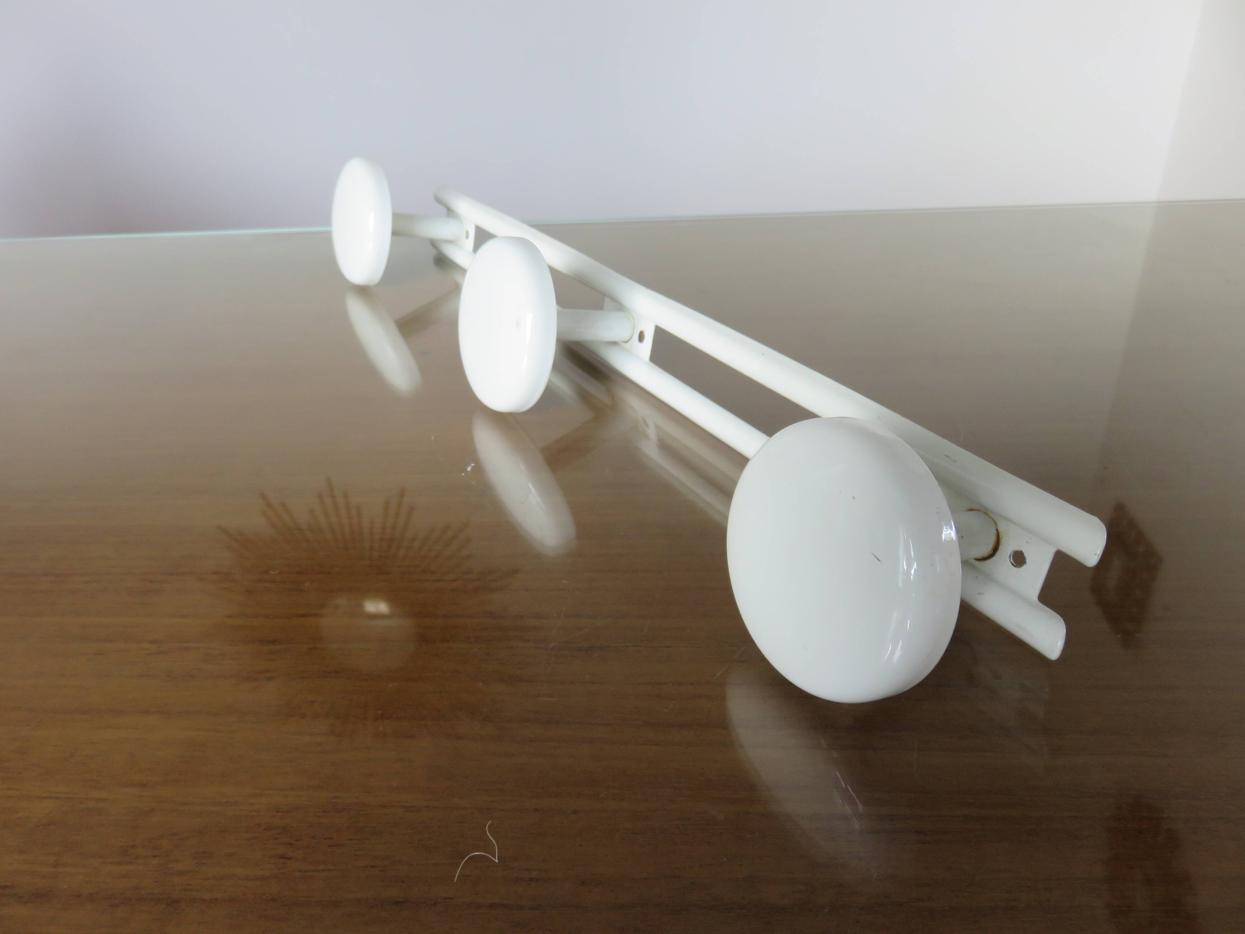 White lacquered metal wall coat rack with 3 hooks, 1970.